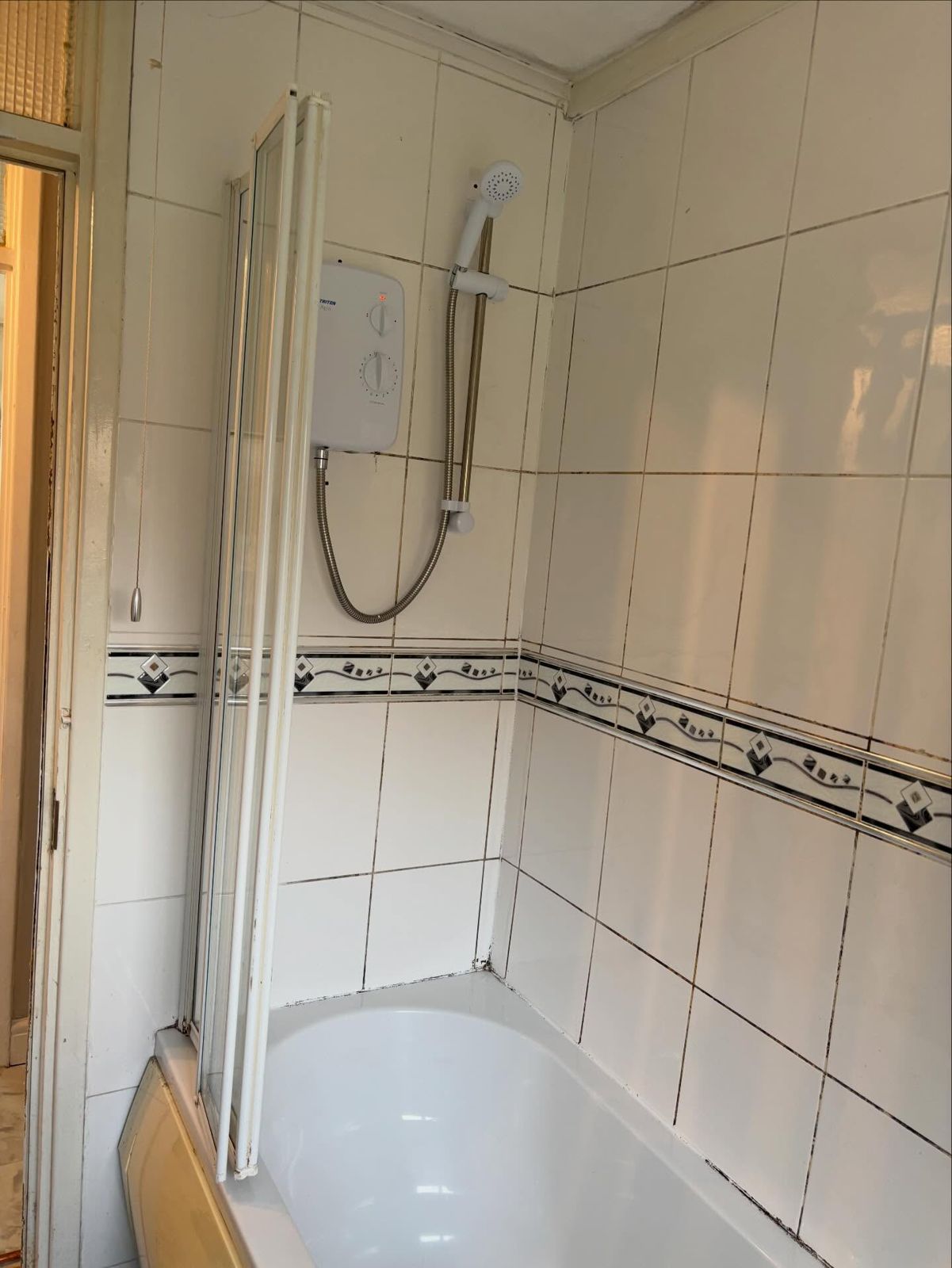 Before: tired tiles and an old suite