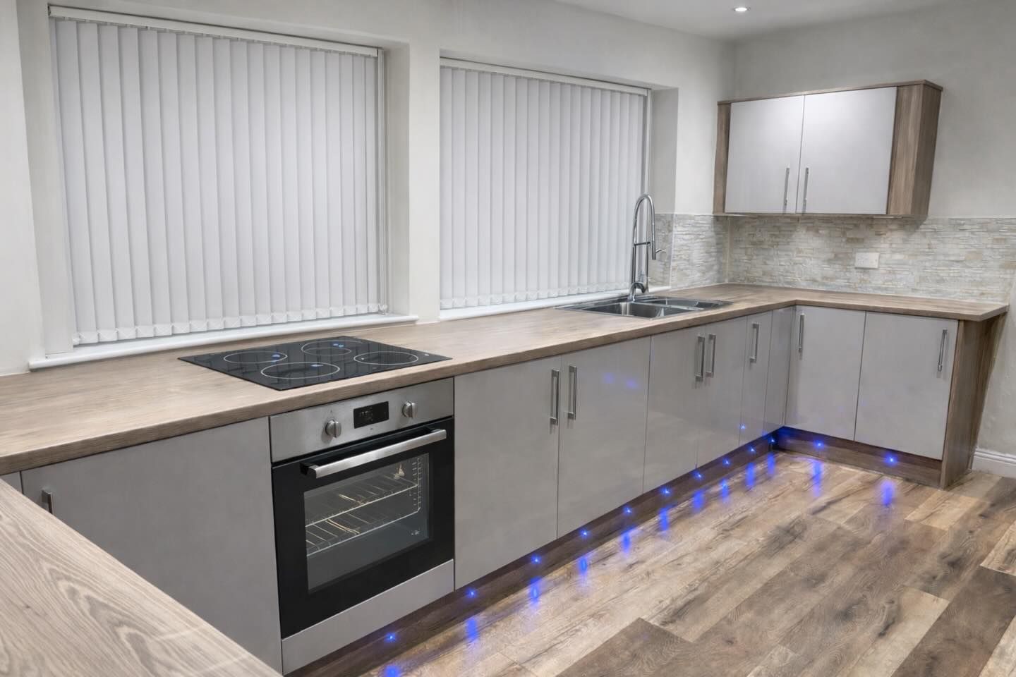 L-shaped kitchen with integrated appliances